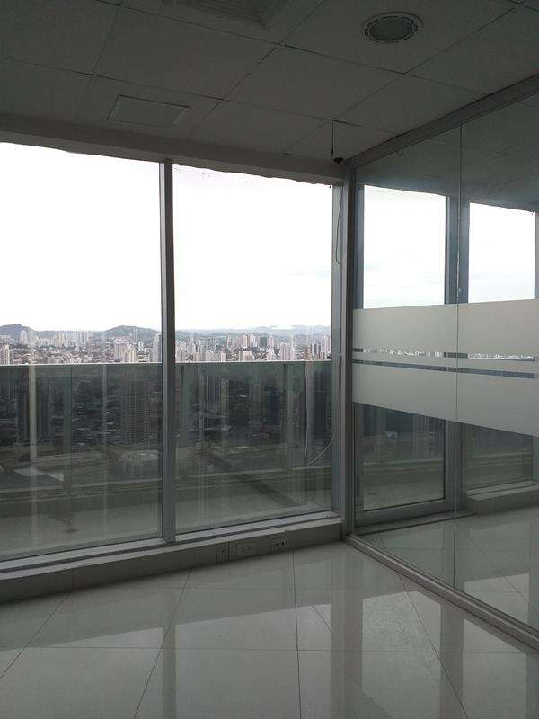 Spacious remodeled office area with floor-to-ceiling glass and city views in F&F Tower Panama City