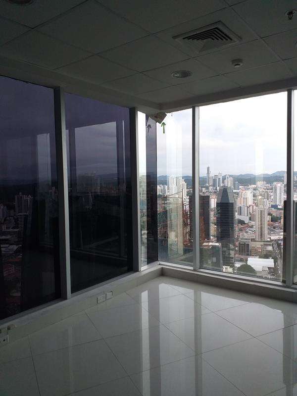Bright open office space with ceramic floors glass partitions Revolution Tower Panama
