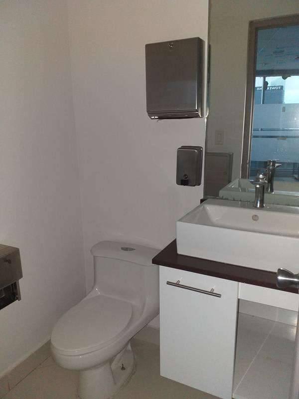 Private office room with glass partitions and city skyline vista in El Tornillo Panama