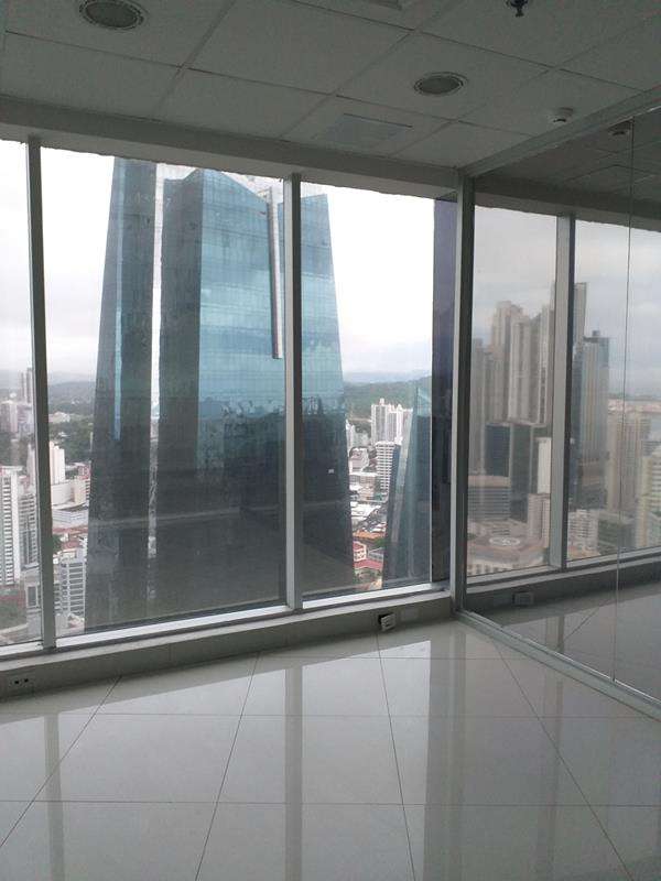 Empty bright office interior with glass walls and open workspace El Tornillo Panama