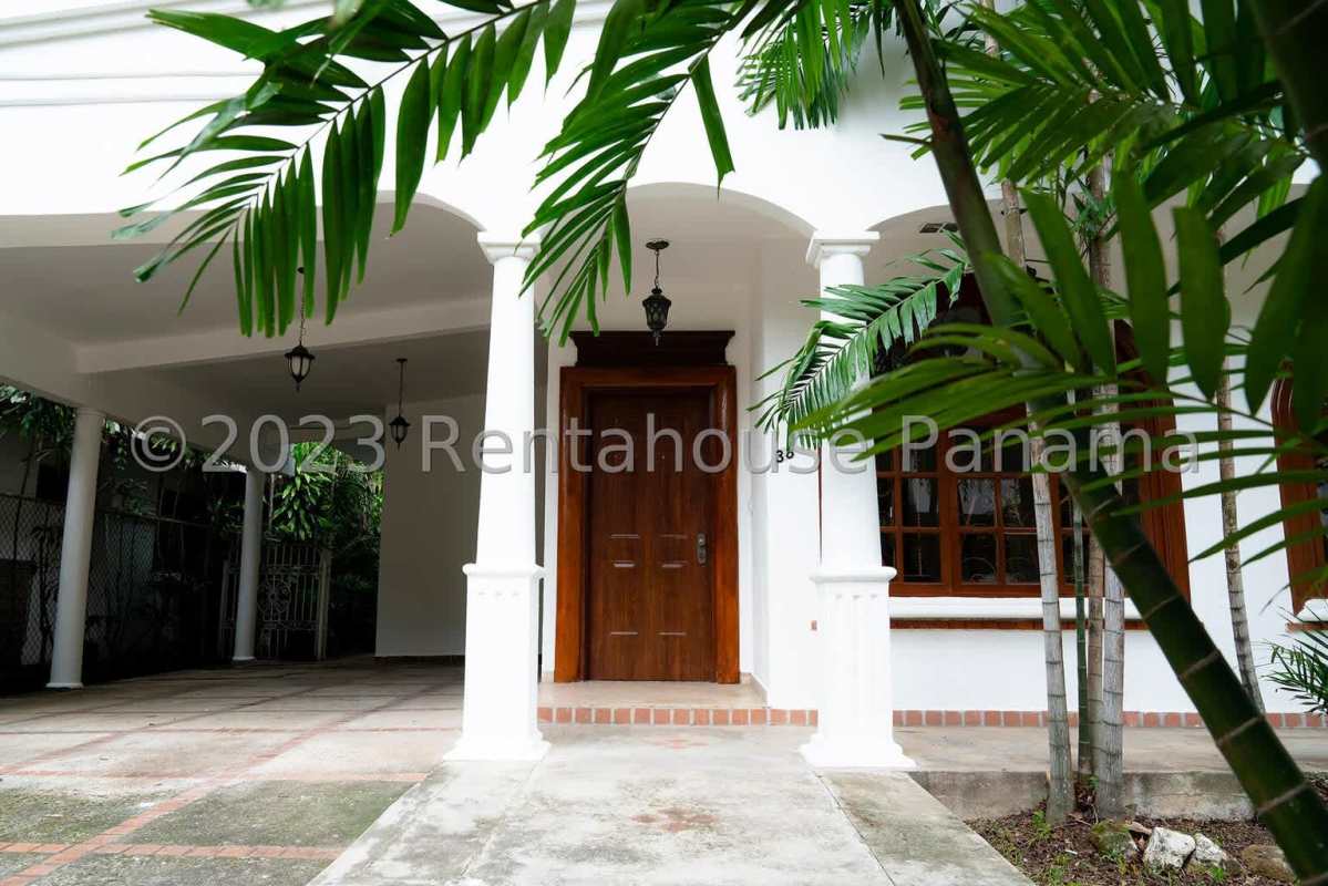Outdoor covered terrace with Mediterranean tile, ceiling fan, glass high table and bar chairs in Obarrio Panama