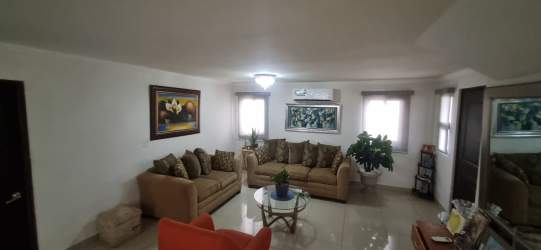 Spacious living room with large windows, porcelain floor, and AC in Sunset Hills Costa Verde Panama