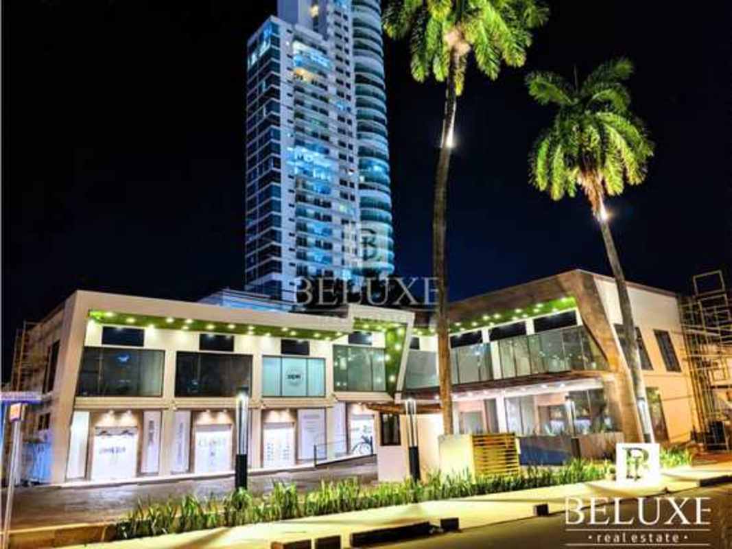 Covered outdoor dining patio with ceiling fans and modern decor at commercial plaza in San Francisco Panama City