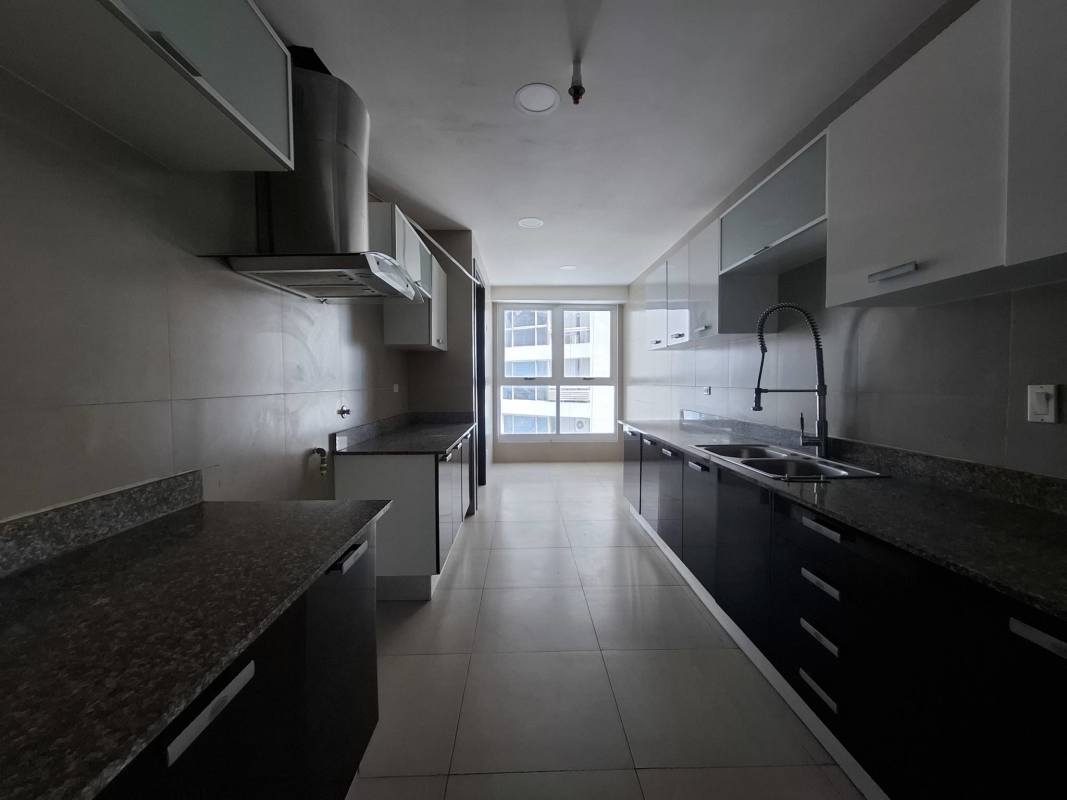 Contemporary kitchen with granite counter, stainless appliances in Q Tower Punta Pacifica Panama