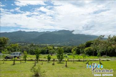 Titled mountain-view lot in Volcancito Boquete with lush green surroundings