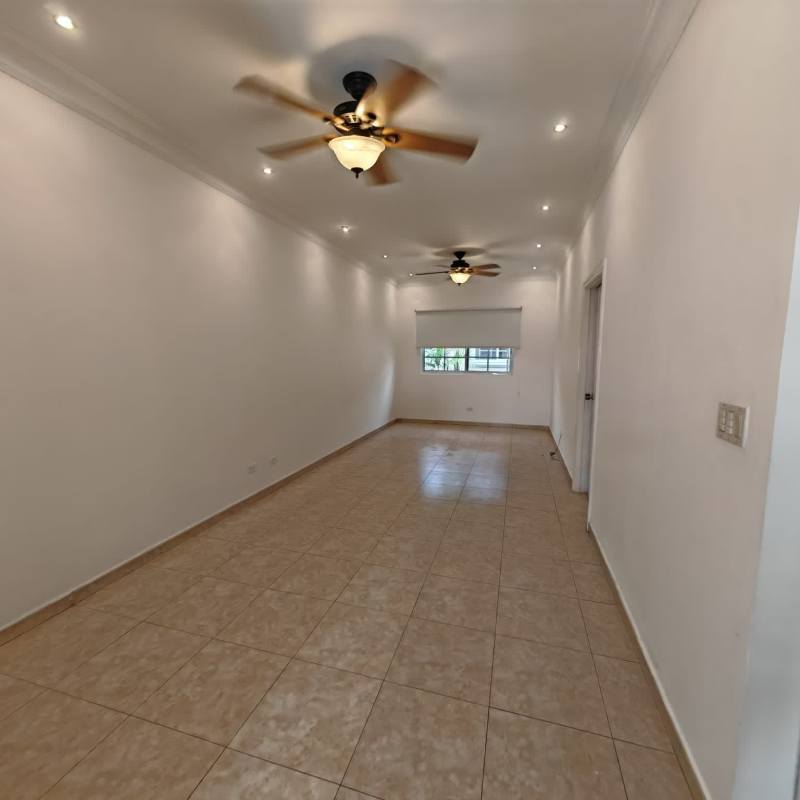 Large living room with tiled flooring, ceiling fans and windows Costa del Este Panama