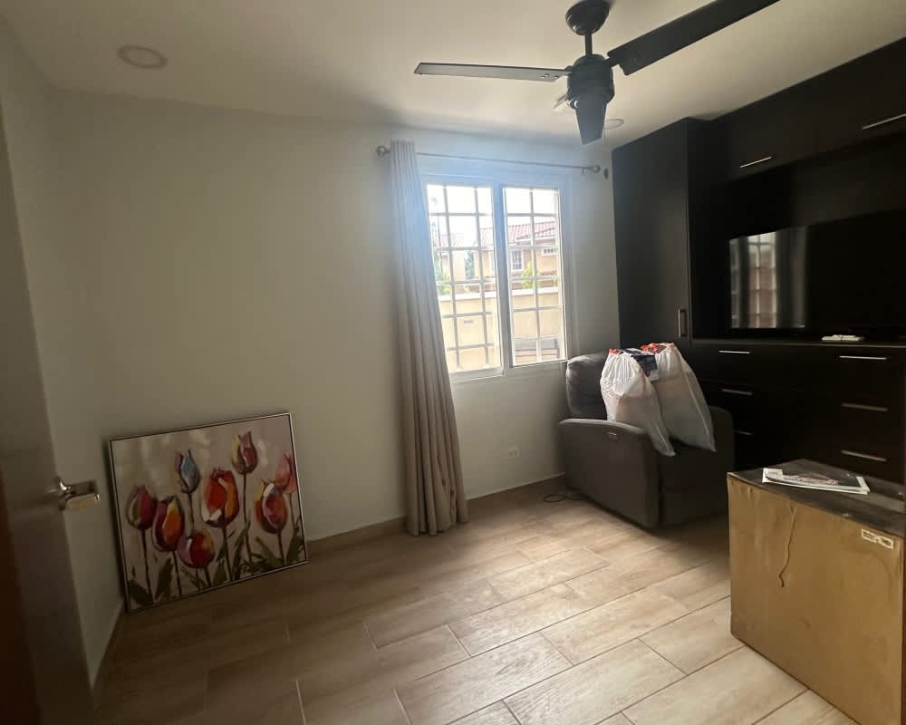 Modern bathroom with granite vanity, glass enclosed shower and tile design