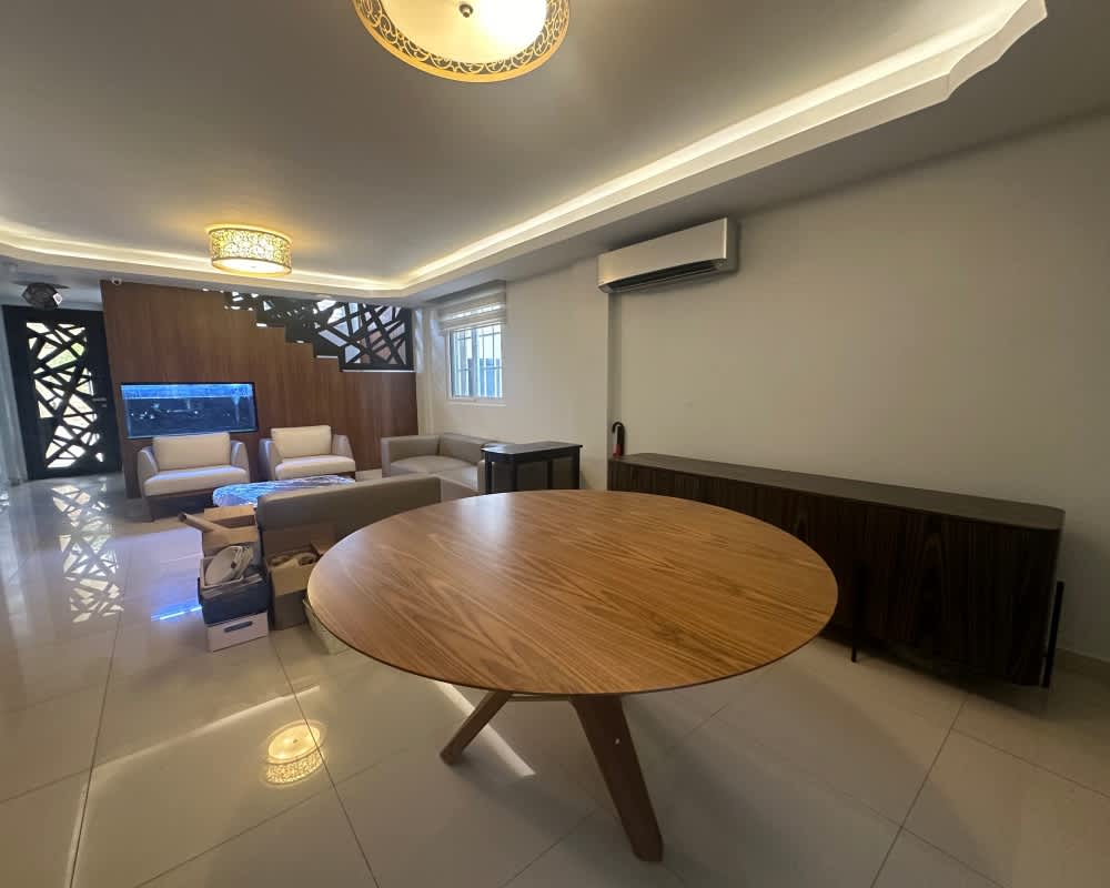 Spacious kitchen featuring granite countertops, stainless appliances, wall oven and fridge