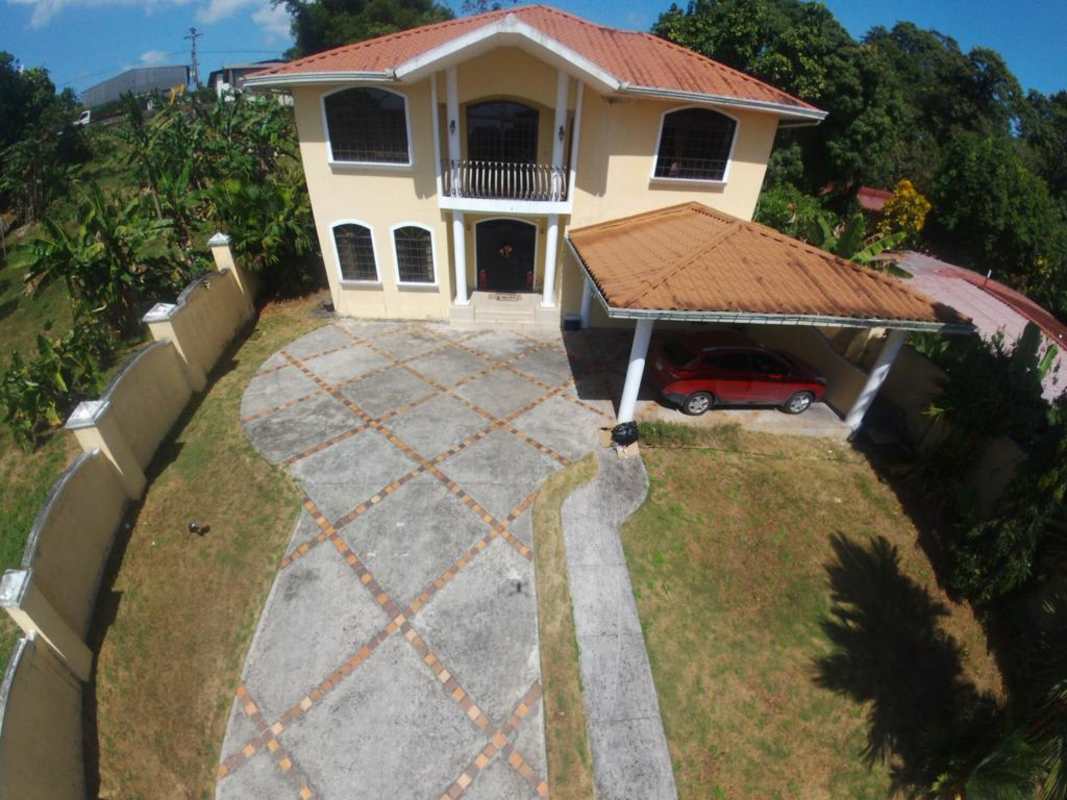 Illuminated garden and covered patio with mosaic floors, night lighting and outdoor furniture Villa Zaita Panama