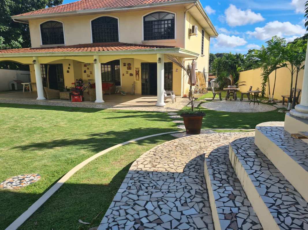Covered porch, seating area, tropical garden and patio mosaic tile flooring Villa Zaita Panama