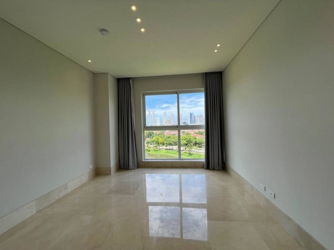 Spacious modern living room with double-height ceiling and marble floors in luxury duplex apartment The Reserve Santa María