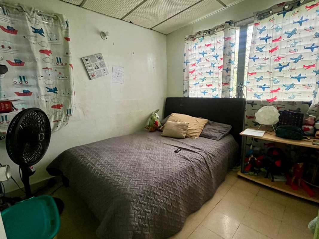 Children's bedroom with grey bedding airplane curtains wall fan Villa Venus Panama