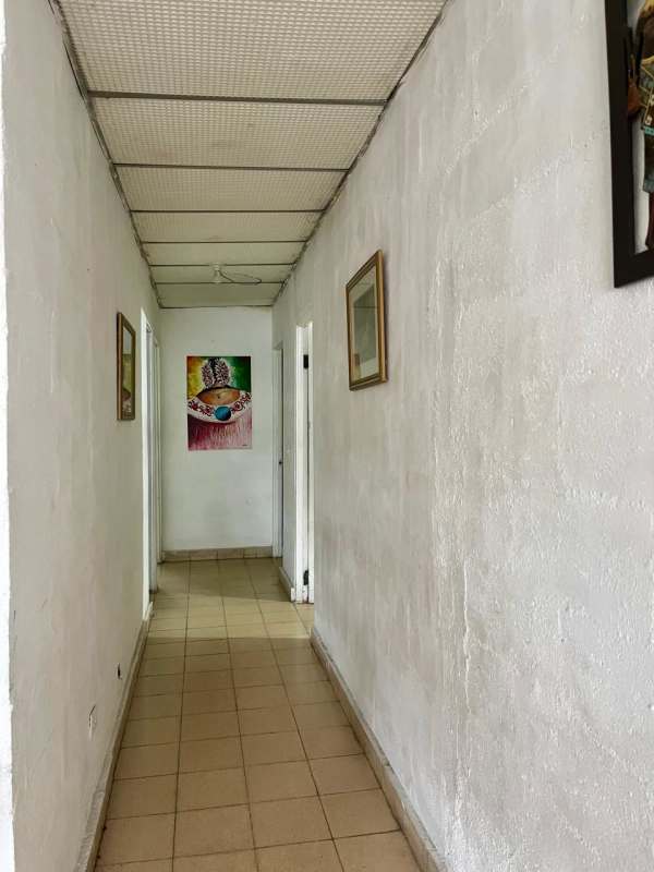 Simple hallway with art beige tiles in Villa Venus Juan Díaz house
