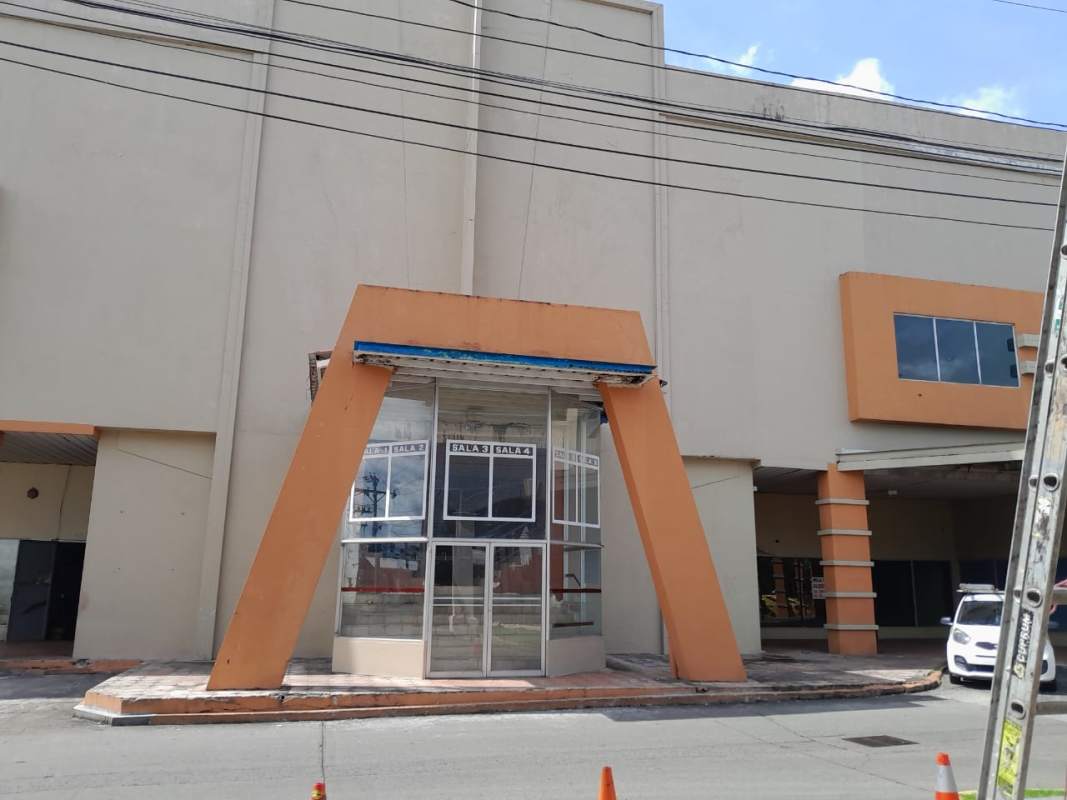 Modern storefront glass façade with orange angular frame on commercial property Plaza Mis Provincia Milla 8 Panama City
