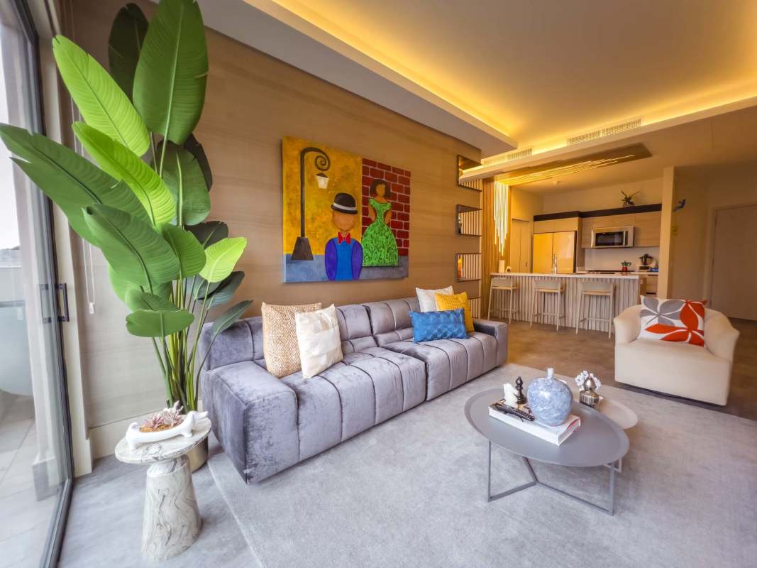 Modern kitchen with island and open dining area in luxury condo Santa María Panama