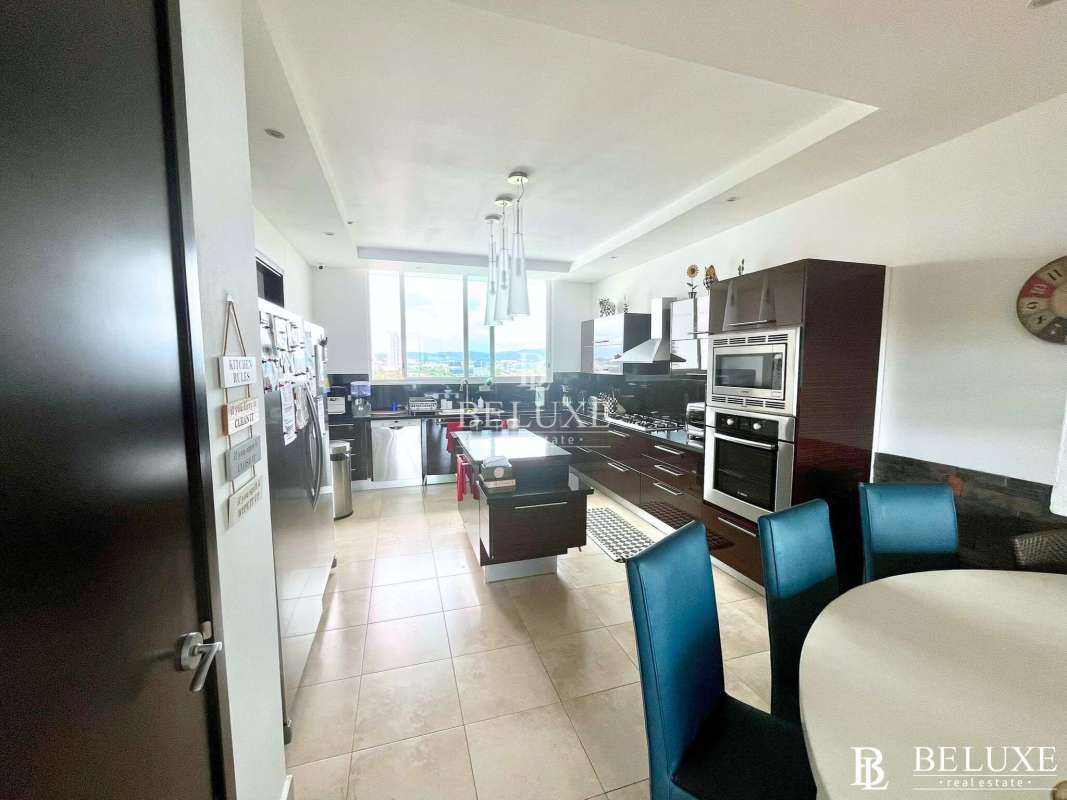 Luxury kitchen with island, stainless appliances and ocean views at PH Acqua II Costa del Este Panama