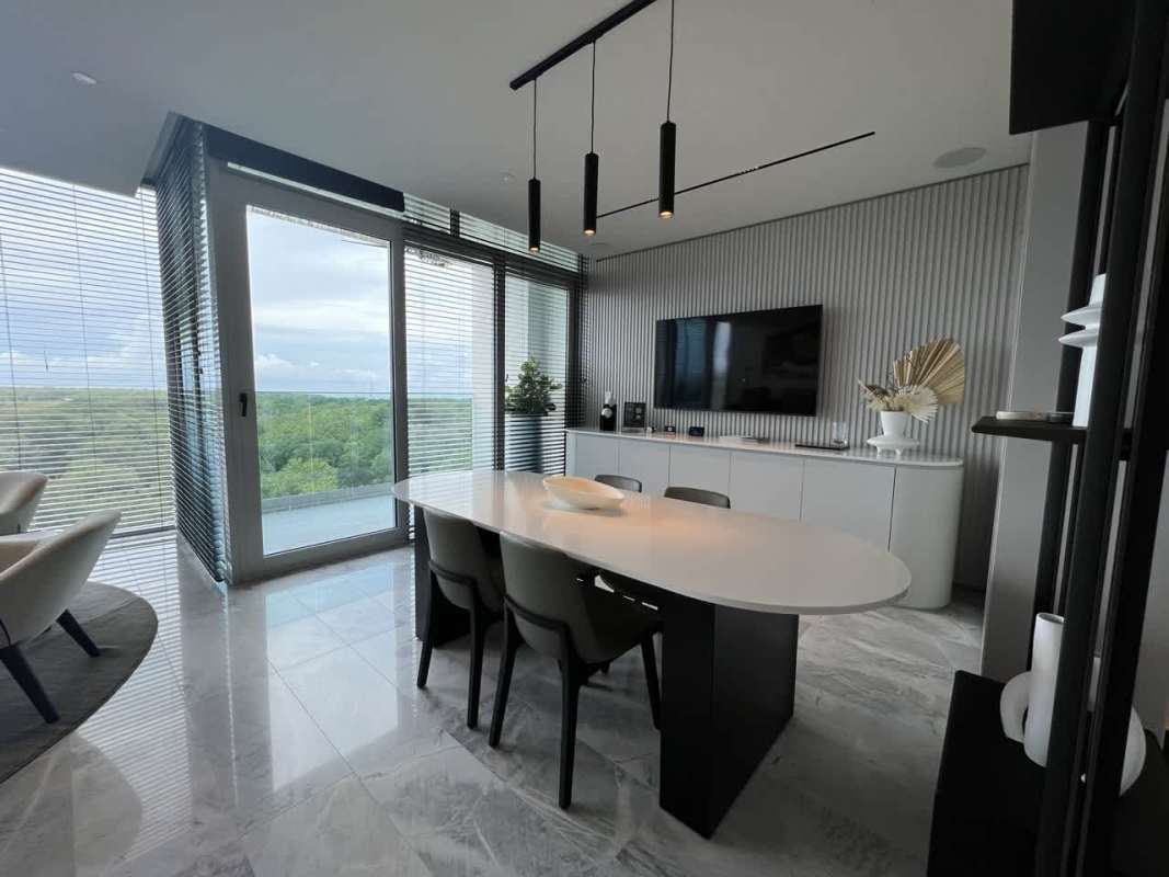 Dining room with floor-to-ceiling windows panoramic green views PH The Ivy Santa María