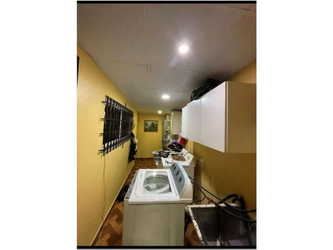 Spacious living room with tiled floors, large mirror, traditional furnishings in Cerro Viento