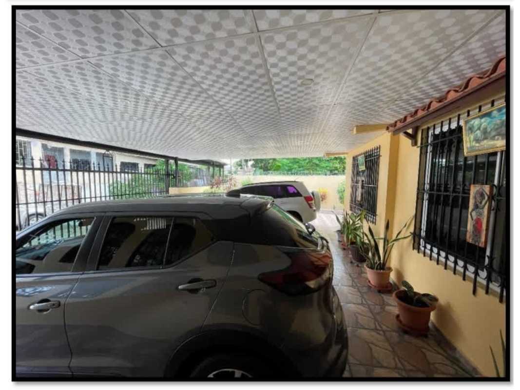 Bedroom with ceiling fan, wardrobe, window with security bars in Pedregal Panama