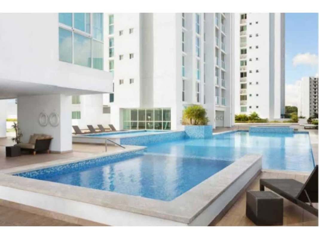 Outdoor swimming pool with sun deck and condo towers in PH Kings Park Condado del Rey Panama