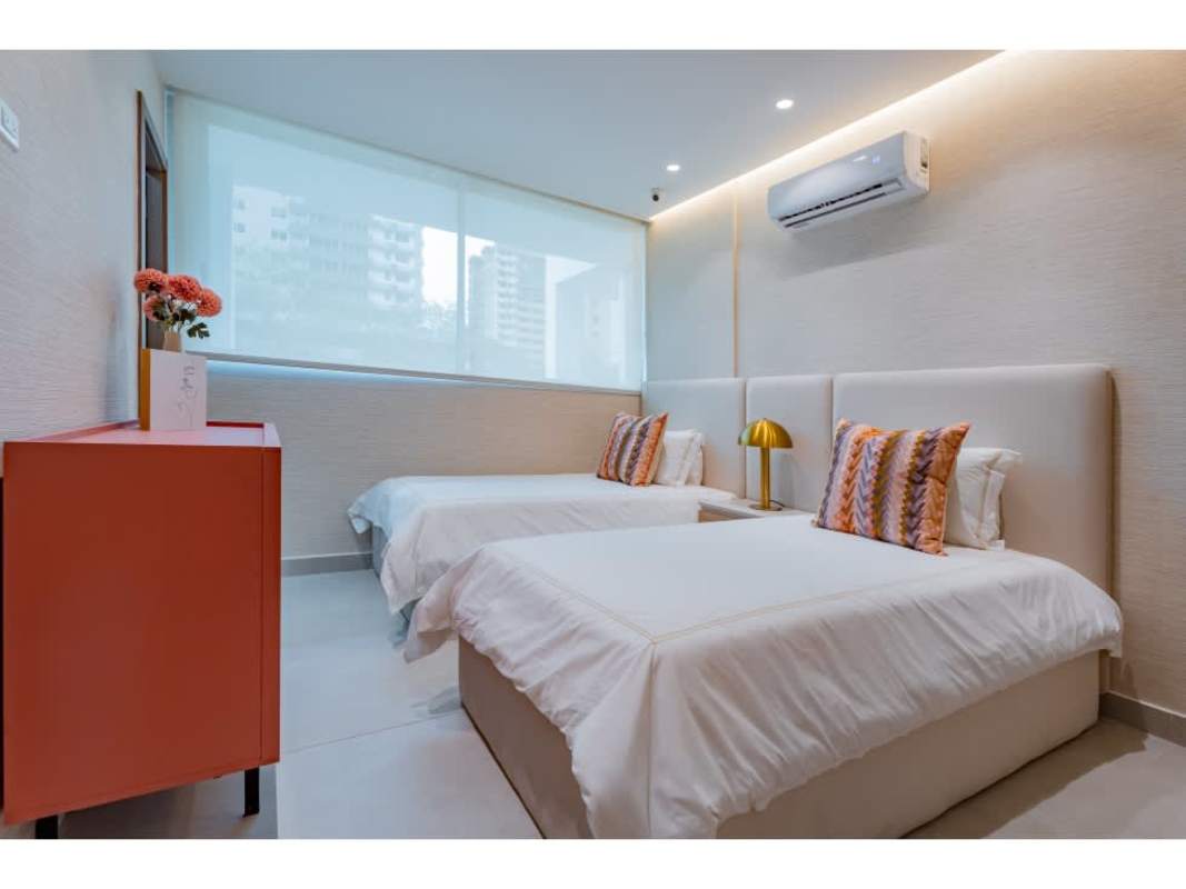 Modern entertainment lounge with pool table, neon signs, and bar at Condado Gardens Panama