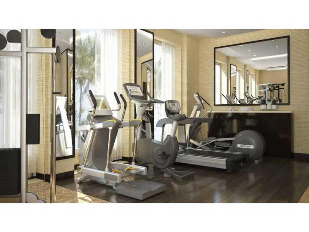 Modern gym with natural light and cardio equipment in PH Mi Condado Panama