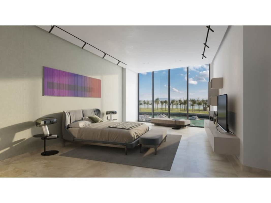 Elegant master bedroom with marble floors, panoramic oceanfront windows in Ocean Reef private islands Panama