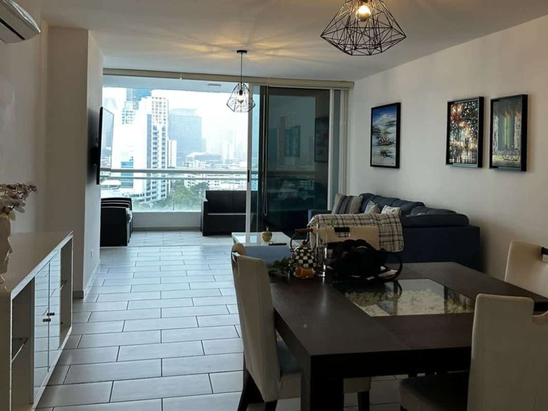 Spacious living and dining area with modern furnishings at PH The Towers San Francisco