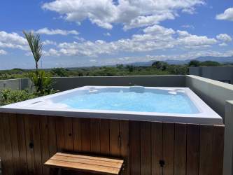 Contemporary kitchen with KitchenAid appliances quartz counters ocean view PH Solaria Punta Caelo Panama