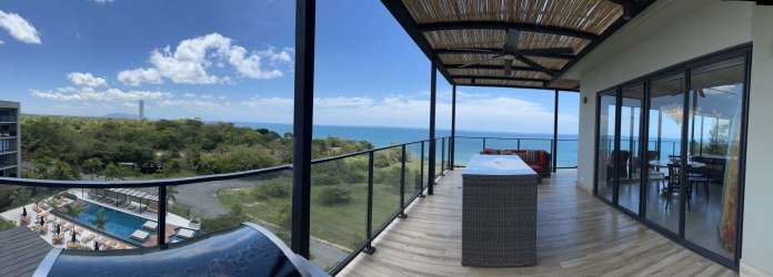 Private terrace with jacuzzi and BBQ overlooking Pacific Ocean in Punta Caelo penthouse rental Panama