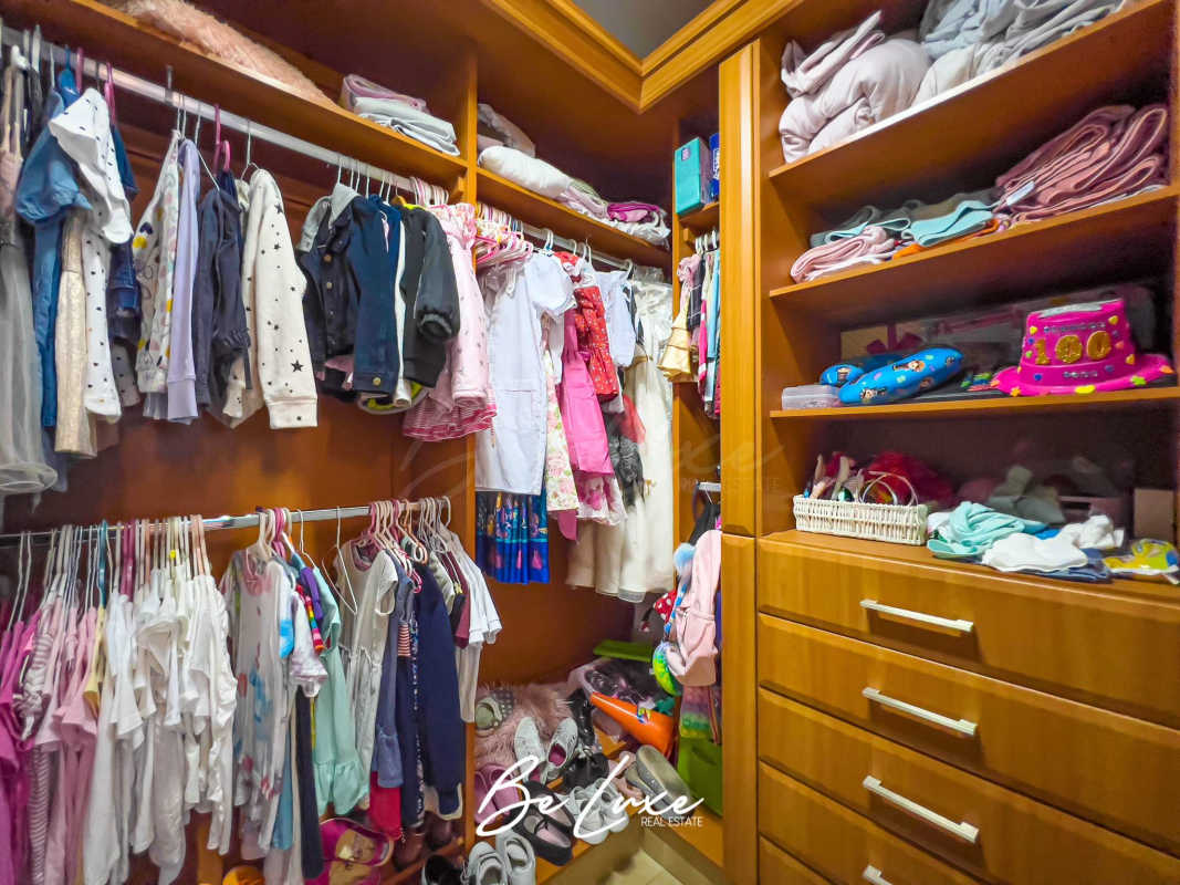 Contemporary bathroom featuring granite countertop, large mirror, and glass shower at PH Ten Tower Costa del Este Panama