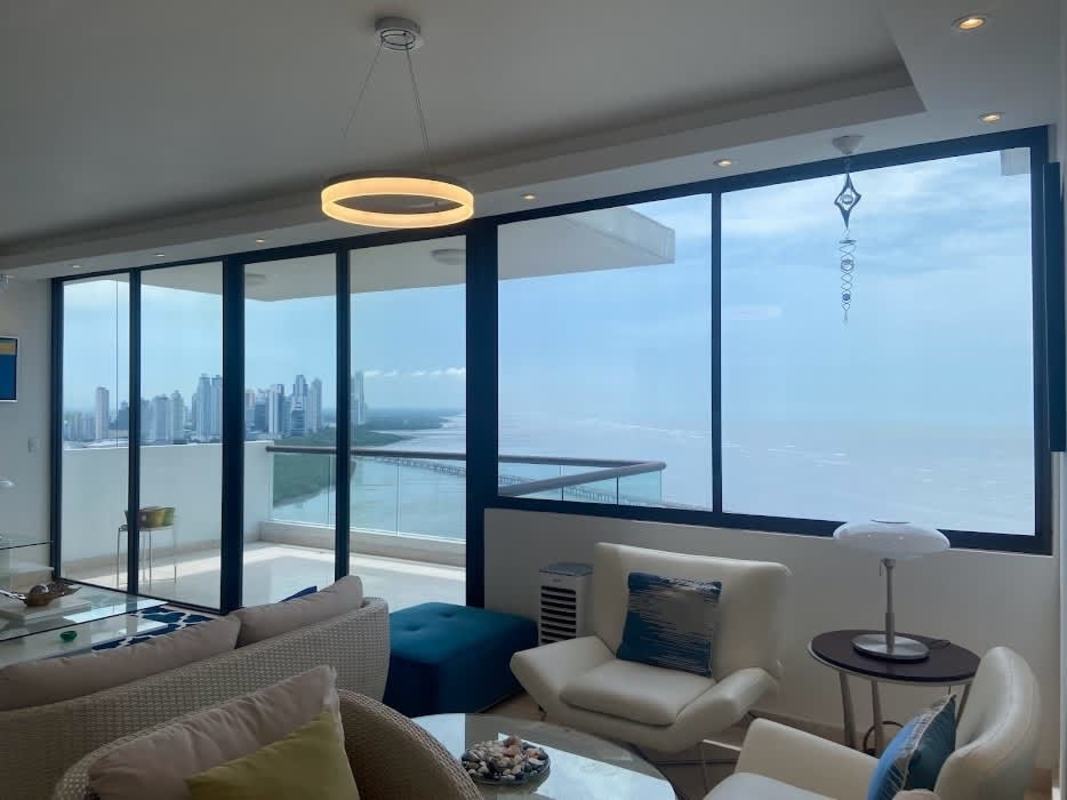 Spacious luxury condo living room with panoramic Pacific Ocean views in PH Dal Mare Coco del Mar