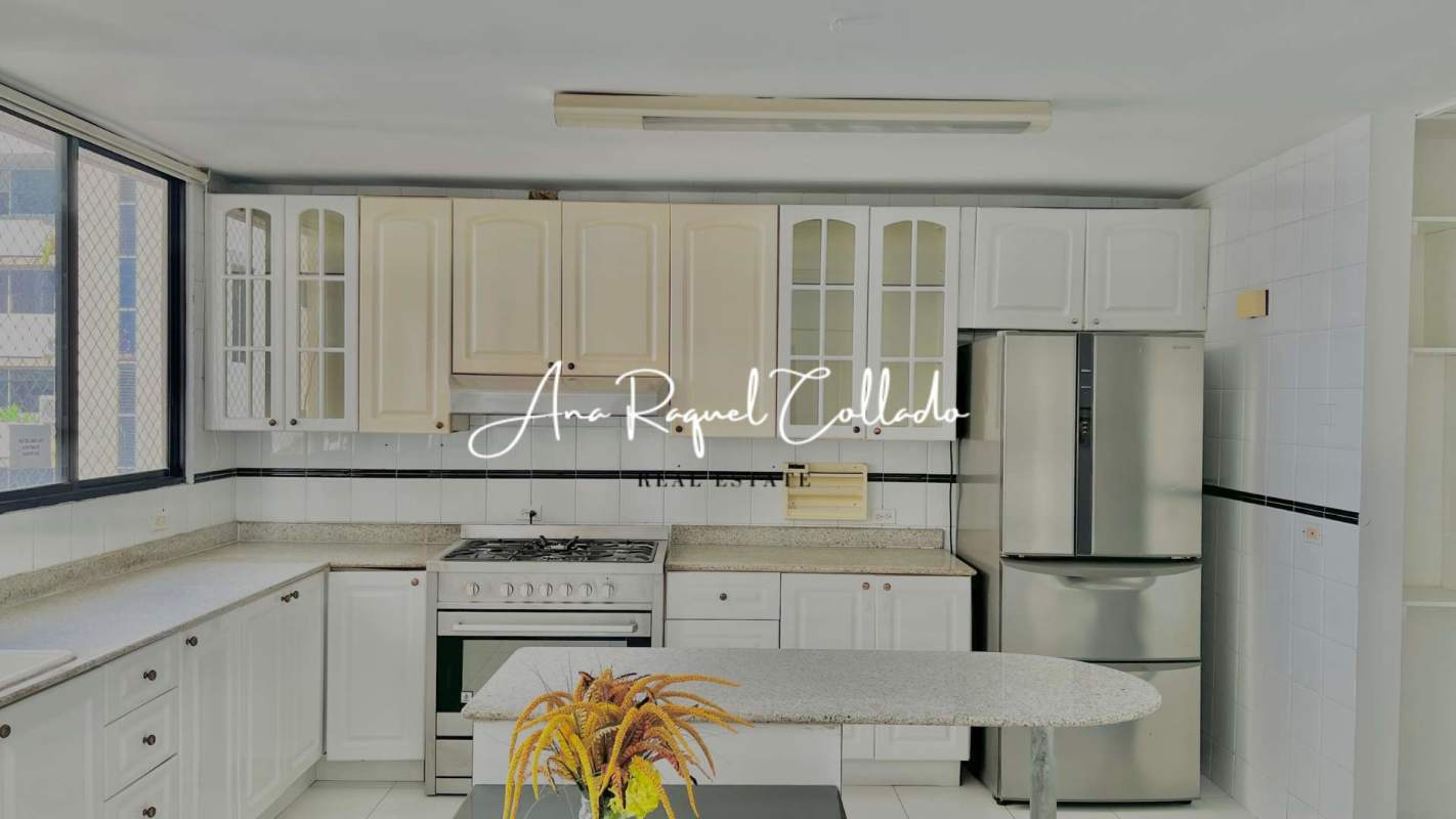 Large bright kitchen with island, granite countertops, gas stove at PH Marina del Mar Marbella Panama City