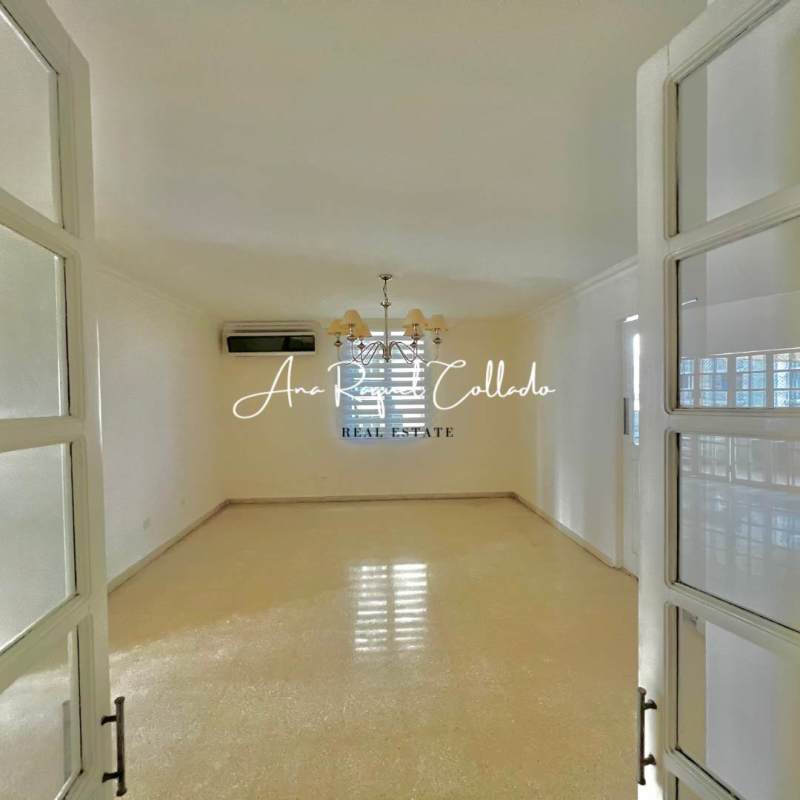 Bright living room with tile floor, chandelier, AC unit PH Marina del Mar Panama City