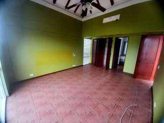 Covered outdoor terrace with white railings and garden views Villas de Decameron Panama