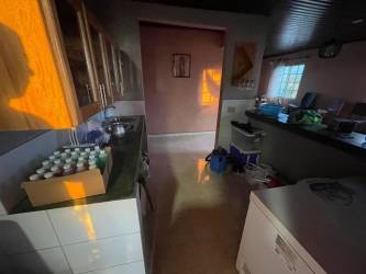 Covered bohío patio with barbecue area, garden view in Santa María Divisa Panama country house