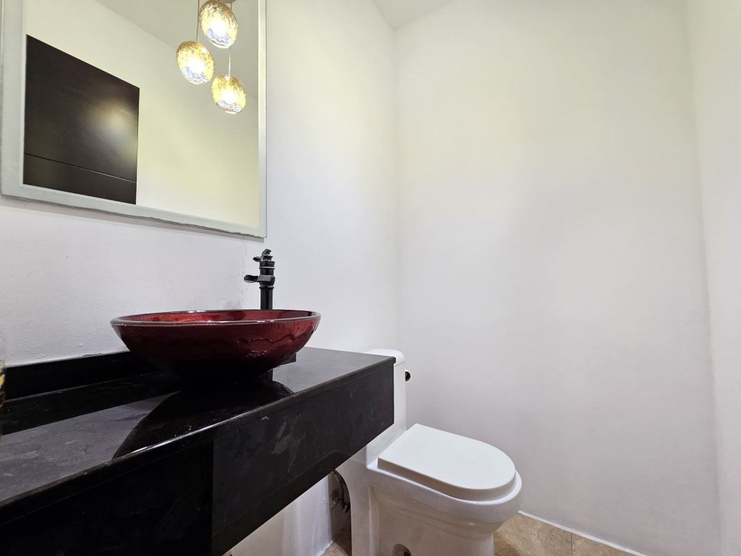 Contemporary kitchen with granite, stainless steel appliances, dark cabinetry in PH Titanium Costa del Este Panama