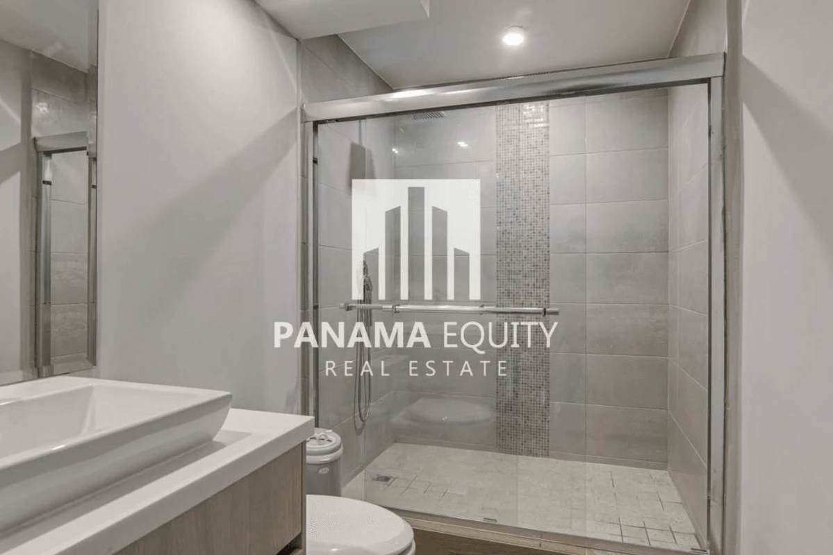 Bright living area with large windows and tile floors in luxury house Punta Paitilla