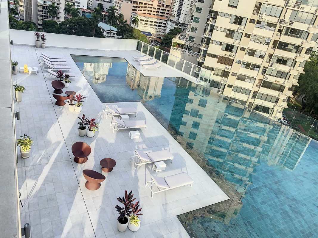 Elegant double-height lobby with marble floors, glass walls and modern decor in PH Costanera Panama