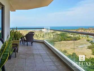 Fully equipped kitchen with granite island, modern cabinetry, large window in Vista Mar Beach condo