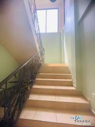 Spacious bedroom with wood wardrobe and ceramic tile flooring for sale in Boquete Panama