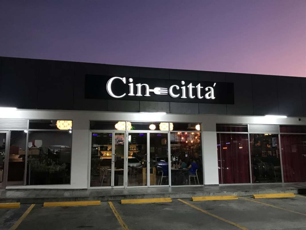 Upscale dining area with colorful decor and modern furnishings inside CineCittá Restaurant in Villa Zaita Panama