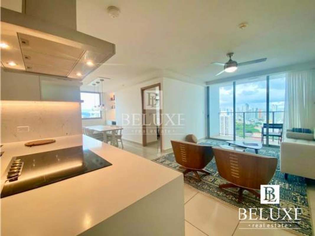 Dining area with custom built table seating 6, beverage fridge in PH Torres de Castilla Panama City