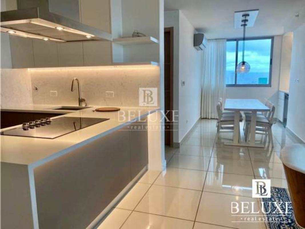 Modern luxury kitchen with quartz waterfall counters, Frigidaire Professional stove and oven in PH Torres de Castilla Panama