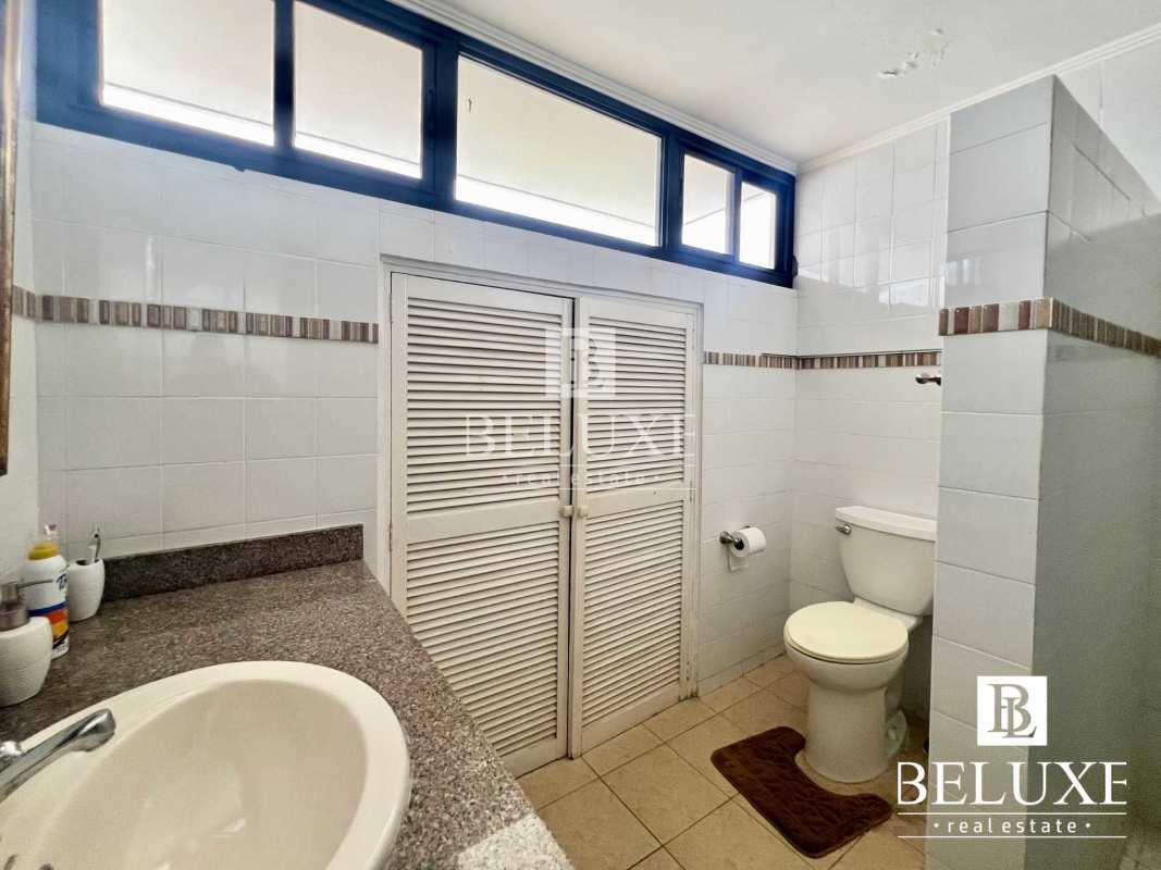 Bedroom with city view window, wardrobe, ceiling fan and AC PH Don Camilo