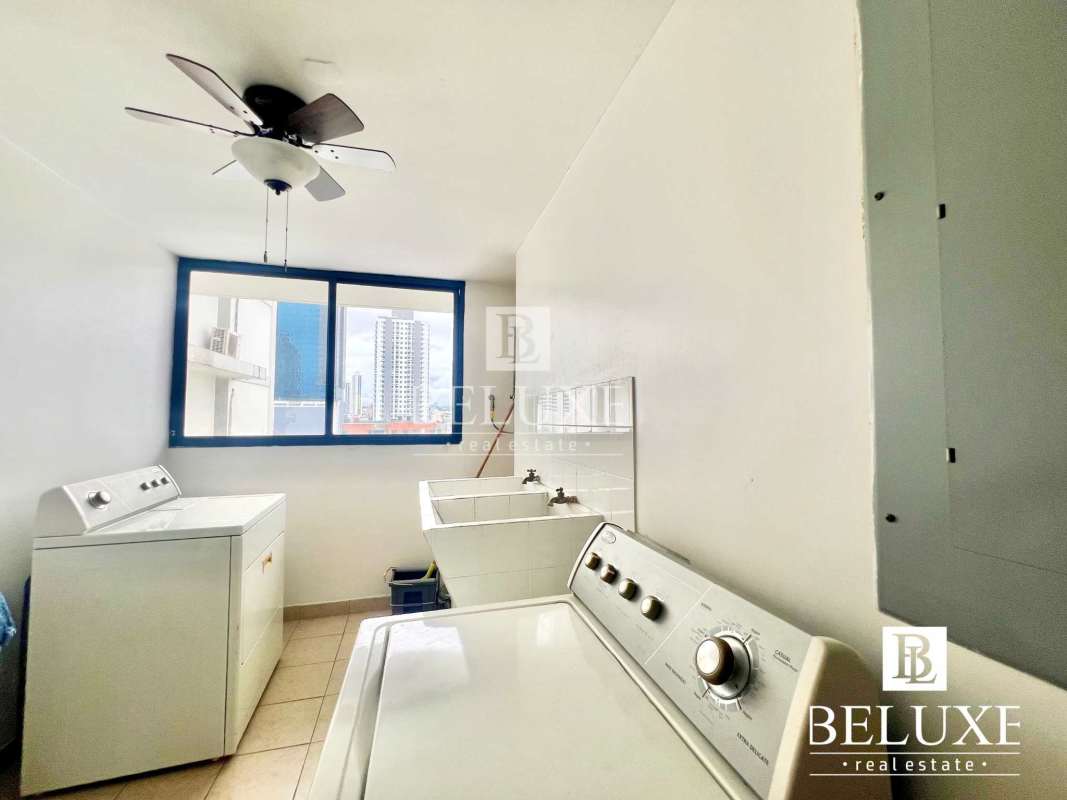 Dining room with large window overlooking skyline Obarrio Panama