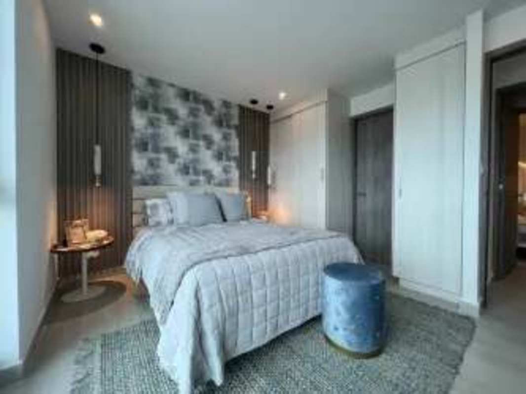 Bedroom with closet, large window, neutral decor at PH Edison Gardens in Panama City