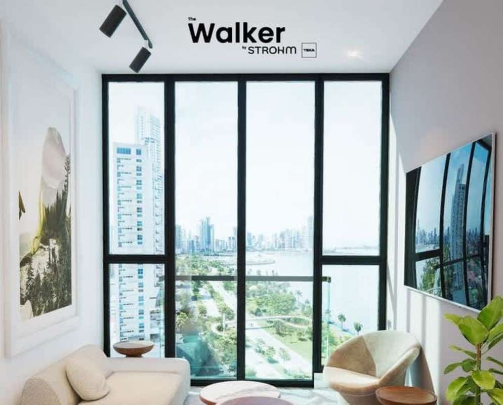 Modern living room in The Walker condo with floor-to-ceiling windows and Panama waterfront skyline views