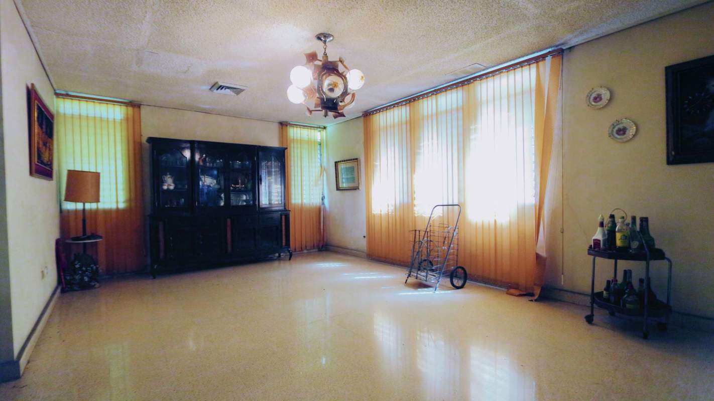 Elevated living room area with large windows ample sunlight Milla 8 house