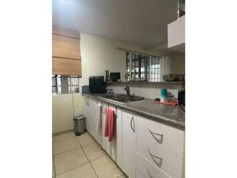 Bright kitchen with modern cabinetry in furnished home for sale Antón Coclé